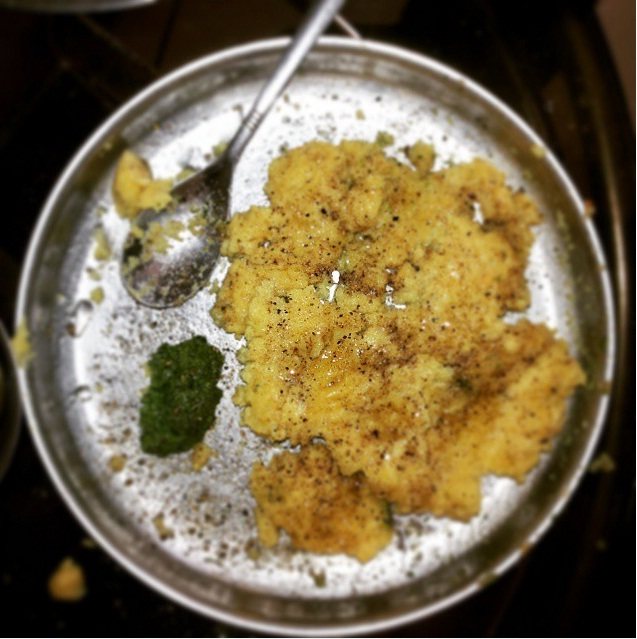 Surti locho — soft steamed savoury with butter and sev